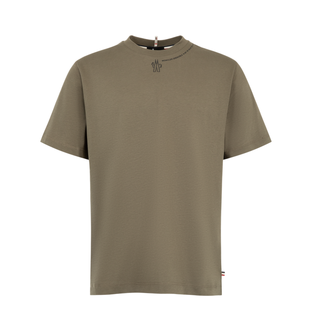 Image 1 of 1 - BROWN - Moncler Men's Cotton Jersey Logo T-Shirt is crafted from cotton jersey and features a slim-fit silhouette, a ribbed crew neckline, short sleeves, and side slits for ease of movement. Designed for both urban and outdoor wear, this versatile essential is finished with embossed logo detailing that adds subtle signature branding. Main Material: 100% Cotton.  