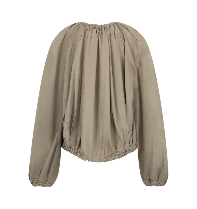 Image 2 of 2 - NEUTRAL - Toteme Women's Gathered Parachute Coat is crafted from a lightweight polyester blend and features a relaxed parachute-inspired silhouette with adjustable drawstrings at the neckline and hem for customizable volume. Designed with a zip-and-snap front closure and side pockets, this designer coat combines functional utility with Toteme's signature minimalist aesthetic, creating a versatile outerwear layer for everyday wear. Main Material:97% Polyester, 3% Polyamide. 