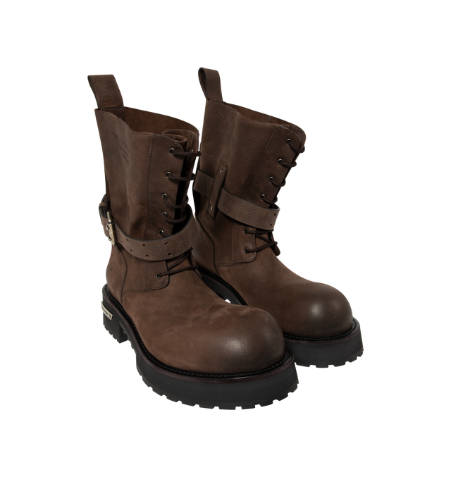 Image 2 of 4 - BROWN - Balenciaga Mens Venom Lace-Up Booties are crafted from grained calfskin leather. Feature a lace-up design, extra round toe, adjustable buckle strap, worn-in finish, debossed logo at the upper, engraved logo plate at the outsole, back pull loop, and thick toothed rubber sole. Main Material: Upper: Calfskin Leather; Sole: TPU; Insole: Calfskin Leather. Made in Italy. 
