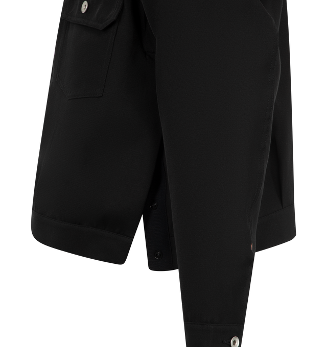 Image 3 of 3 - BLACK - Sacai Double Faced Jacket has a spread collar, a front button closure, pleats at the front, flap pockets, press stud vents at the side seams, button cuffs, pleats at the back yoke, and adjustable button tabs at the back hem. 54% silk, 46% cotton. Made in Japan.  