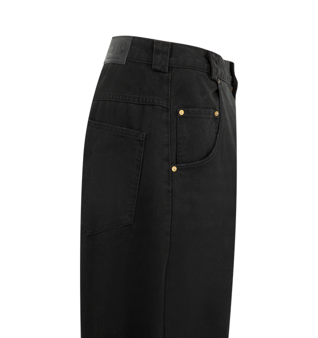 Image 3 of 3 - BLACK - Willy Chavarria Men's True Bad Boy Jean is crafted from cotton denim and features an exaggerated oversized silhouette with a low-rise waist and dropped crotch. Designed with an extra-wide leg, this designer jean is detailed with a gold-tone button fly, signature "W" belt loops with a key loop, classic five-pocket construction, and a leather "WILLY" patch at the back. Main Material: 100% Cotton. Made in USA. 