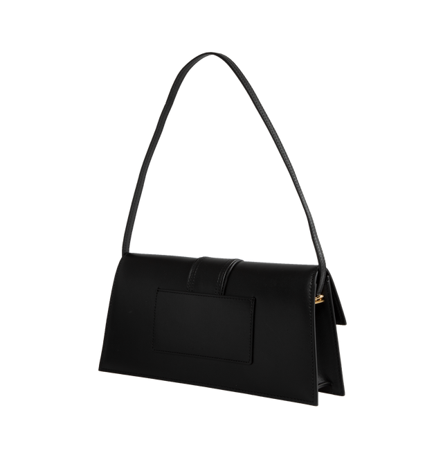 Image 2 of 3 - BLACK - JACQUEMUS Le Bambino Long Bag featuring smooth leather structured shoulder bag, magnetic flap tab closure, slim shoulder strap, back patch pocket, interior card pocket, gold metal logo and hardware, fully lined in cotton and dyed edges. 28 x 13.5 cm. 100% cowskin. Made in Italy. 