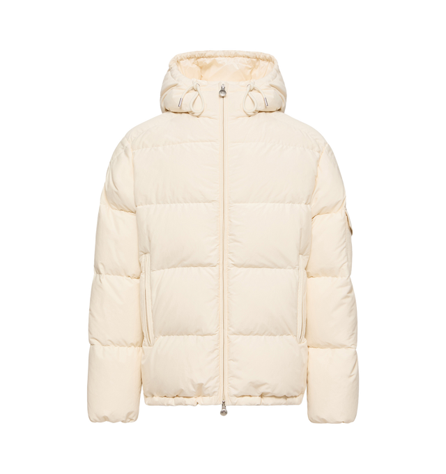 Image 1 of 1 - CREAM - Moncler Men's Himalaya Down Jacket is crafted from a cotton and nylon blend and features a loose-fit silhouette, down-filled insulation, an adjustable hood, and a front zip-and-snap-button closure. Inspired by Moncler's expedition heritage, this modern interpretation of the iconic Himalaya is finished with zipped exterior and interior pockets, a drawstring hem for a customizable fit, and a vintage-inspired metal logo that references archival alpine insignia. Main Material: 73% Cotton, 
