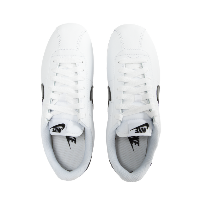 Image 5 of 5 - WHITE - NIKE CORTEZ leather lace-up sneaker featuring foam midsole, wedge insert, leather upper, rubber sole with herringbone pattern and a padded, low-cut collar. 