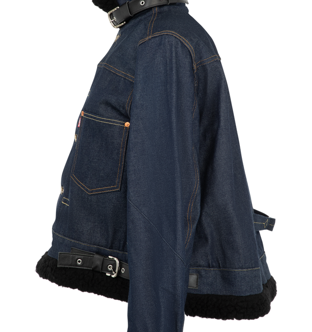 Image 3 of 6 - BLUE - Sacai X Levi's Women's Denim Jacket are crafted from a premium dark wash rigid indigo denim paired with contrasting plush black faux-shearling/sherpa accents at the collar, cuffs, and hem. Main Material: 100% Cotton. Made in Japan. 