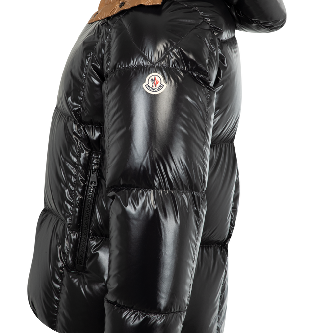 Image 3 of 4 - BLACK - MONCLER Parana Hooded Short Down Jacket featuring nylon laqu lining, down-filled, detachable and adjustable hood, zipper and snap button closure, zipped pockets and hem with drawstring fastening. 100% polyamide/nylon. Padding: 90% down, 10% feather. Made in Romania. 