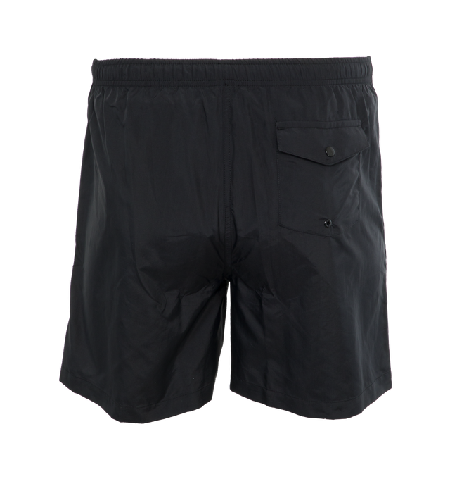 Image 2 of 4 - BLACK - NOAH CORE SWIM TRUNK crafted from 100% nylon with poly mesh liner. Elastic drawstring waist, on-seam front pockets, flap back pocket with snap closure and drain vent.  Ultralight and quick-drying, as high-performing in the water as they are on land. Featuring solid proportions, functional pockets, an essential summer staple. Made in Portugal. 