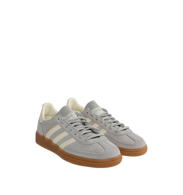 Image 2 of 5 - GREY - Adidas Originals Handball Spezial lace-up sneakers with premium smooth silver-color suede and leather upper featuring off-white tri-stripes, Spezial tongue logo, metallic signature on the side and gum rubber outsole. 