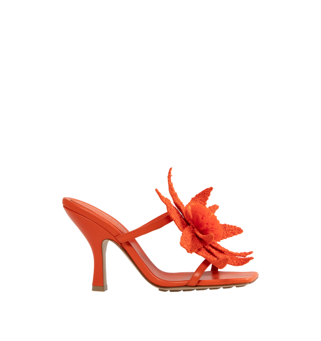 Image 1 of 4 - ORANGE - BOTTEGA VENETA Adam Sandal featuring leather mule sandal with raffia flower embroidery and rubber-injected leather outsole. Lambskin, raffia. Heel: 3.5. Made in Italy. 