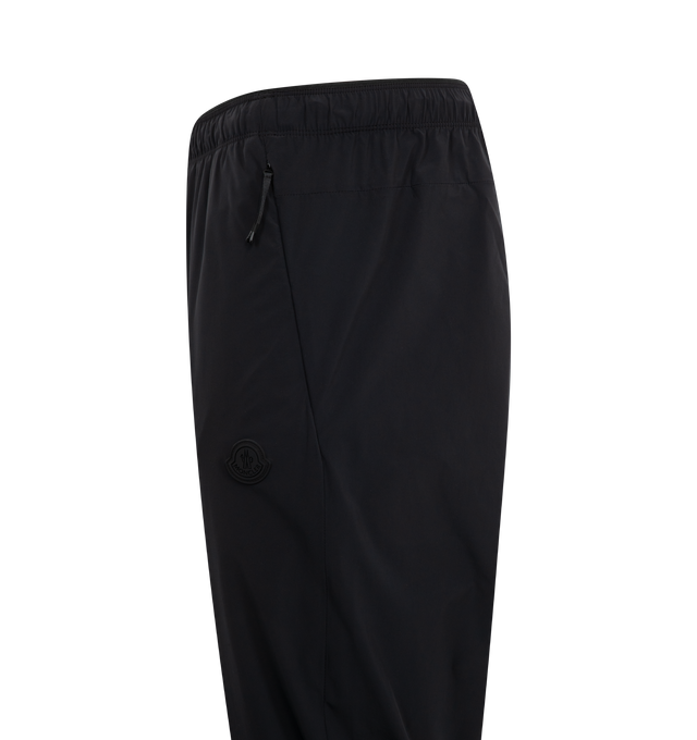 Image 3 of 3 - BLACK - MONCLER Logo Patch Jogging Pants featuring recycled bi-stretch nylon, waistband with elastic drawstring fastening, zipped pockets, elastic cuffs and silicone logo patch. 80% polyamide/nylon, 20% elastane/spandex. Made in Bulgaria. 