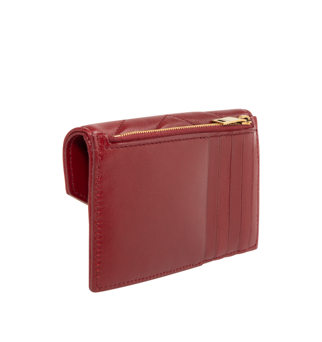 Image 2 of 3 - RED - SAINT LAURENT Flap Card Case in lambskin featuring zip card holder with flap, logo on front, quilted topstitching, bronze-tone hardware, snap-button closure, five card slots, one zip pocket and one flat pocket. 5.1" x 3.1" x 0.8". Lambskin. Made in Italy. 