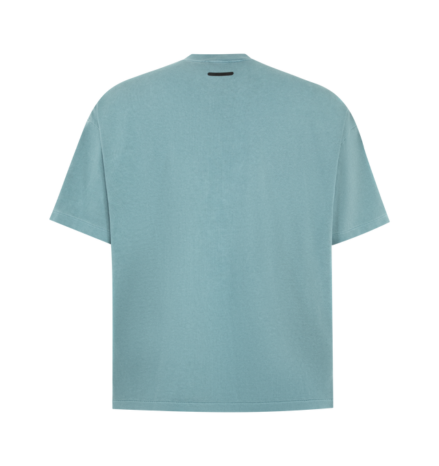 Image 2 of 2 - BLUE - FEAR OF GOD ESSENTIALS Campus 90s Tee featuring heavyweight cotton jersey, pigment dyed, crewneck, 90s fit with oversized proportions and dropped shoulders, campus puff-print graphic on front and Fear of God Essentials label at the back neckline. 100% cotton. 