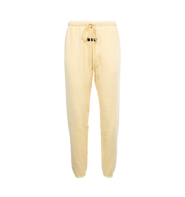 YELLOW - FEAR OF GOD ESSENTIALS Drawstring Sweatpants featuring drawstring at elasticized waistband, two-pocket styling, rubberized logo patch at front and elasticized cuffs. 80% cotton, 20% polyester. Made in Viet Nam.