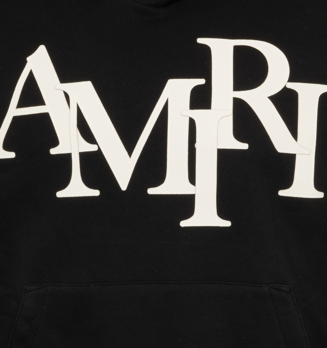 Image 3 of 3 - BLACK - AMIRI Staggered Hoodie featuring logo-lettering patches to the front, drawstring hood, long sleeves, front pouch pocket, straight hem and french terry lining. 100% cotton.  