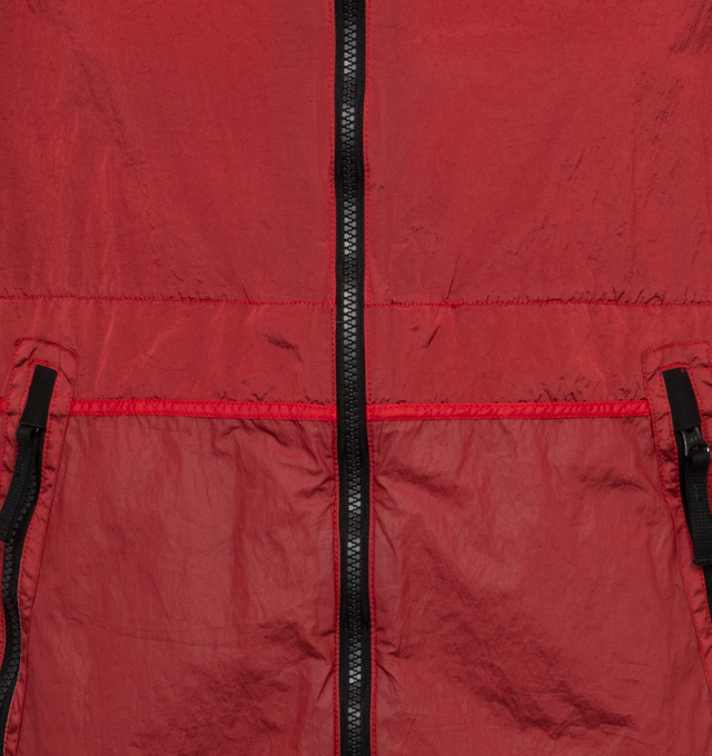 Image 3 of 3 - RED - STONE ISLAND Patch Jacket featuring cinch straps and bungee-style drawstring at hood, two-way zip closure, zip pockets, raglan sleeves, detachable felted logo patch at sleeve, rib knit cuffs, lightweight resin-coated crinkled double-dyed ECONYL regenerated nylon taffeta and wind and water-resistant. 100% polyamide. 100% polyurethanic resin. Made in Romania. 