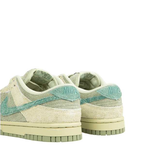 Image 3 of 5 - MULTI - NIKE Dunk Low Sneaker crafted with hairy suede upper in shades of olive aura, bicoastal, and oil green featuring lace-up front, signature Swooshes at sides, embossed Air logo at foxing, perforated toe and padded collar with debossed Nike logo at back counter. 