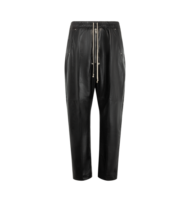 Image 1 of 3 - BLACK - Rick Owens Men's Bela Pants are crafted from lightweight waxed lamb leather and feature a loose-fit, full-length silhouette with a dropped crotch. Designed with an elasticized drawstring waistband, exposed zip Bela fly, side welt pockets, and back flap pockets with snap closures. Main Material: 100% lamb leather. Lining: 100% cupro.  