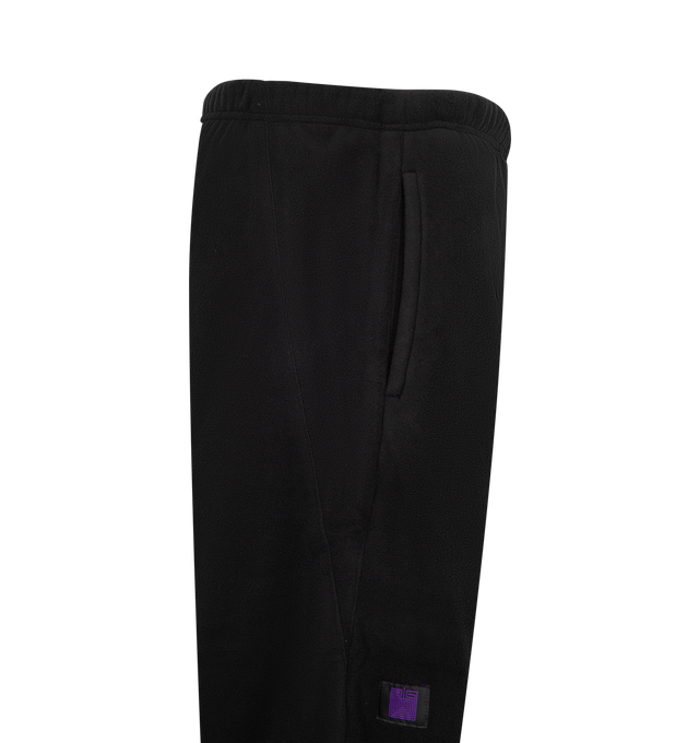 Image 3 of 3 - BLACK - Needles Men's Between Pant - Poly Fleece is crafted from polyester fleece and features a relaxed silhouette designed for everyday comfort. Blending the brands signature sportswear influences with functional construction, this style offers a soft handfeel and versatile fit suitable for casual wear. Main Material: Polyester Fleece. Fit: Relaxed. Made in Japan. 