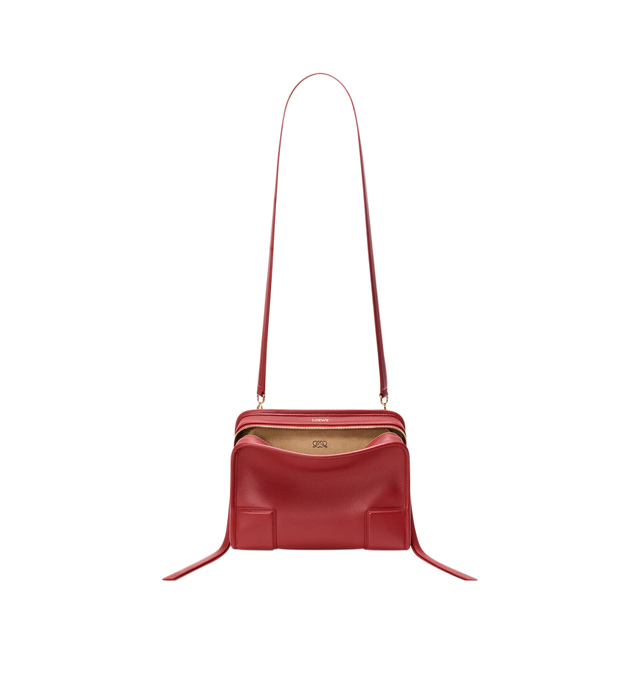 Image 10 of 18 - RED - Loewe Small Amazona 180 Bag in leather features a relaxed silhouette anchored by a single toron top handle, designed to be carried open, while a concealed closure secures the main compartment, three carry options: short handle, removable shoulder strap and crossbody, zip closure with two leather zip pullers, two compartments, main compartment closed with magnetic closure, internal flat pocket, left side d-ring for customization, nappa lambskin lining, and embossed double L branding. L 