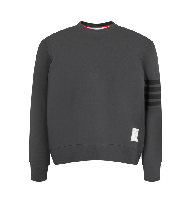 Image 1 of 2 - GREY - Thom Browne Men's 4-Bar Crewneck Sweatshirt is crafted from loopback cotton and features the brands signature 4-bar detailing at the sleeve. Designed with a classic crewneck silhouette, the sweatshirt is finished with rib-knit trim, cuffed sleeves, a straight hem, a branded patch at the hem, and Thom Brownes signature striped tab at the back neck. Main Material: Cotton. 