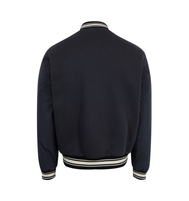 Image 3 of 4 - NAVY - MONCLER Vennes Reversible Down Bomber Jacket featuring cotton fleece, longue saison lining, reversible, micro soft back and arms, zipper closure, pockets with snap button closure, cuffs and hem with striped rib knit trim and terry cloth monogram patch. 