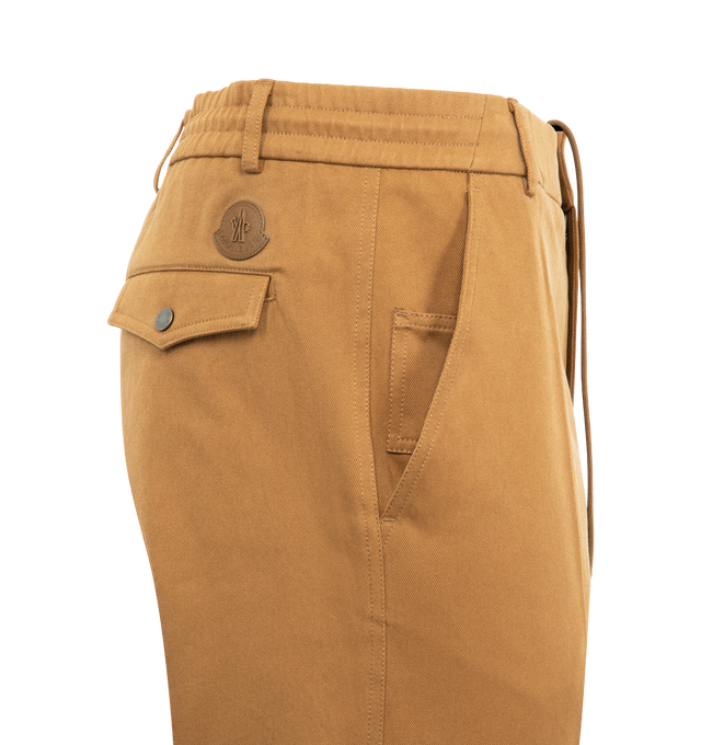 Image 3 of 3 - BROWN - MONCLER Cotton Tailored Pants featuring cotton drill, waistband with drawstring fastening, button and zipper closure, pockets with snap button closure and ribbed trim. 100% cotton. Made in Romania. 