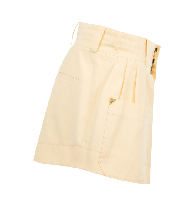 Image 3 of 3 - CHAMPAGNE - CHLOE High-Rise Mini Shorts featuring front zipper & horn button, maxi front patch pocket, left-side pocket, single piped back pocket and gold metal Chlo logo triangle at front pocket. 100% cotton. 
