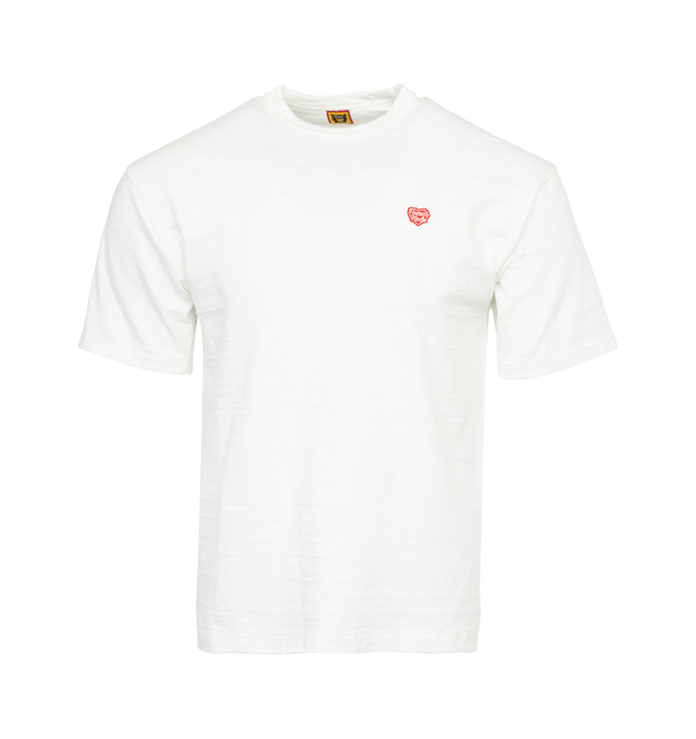 WHITE - HUMAN MADE Heart Badge T-Shirt featuring brand print on back, signature heart emblem on front, short sleeves and crew neck. 100% cotton.