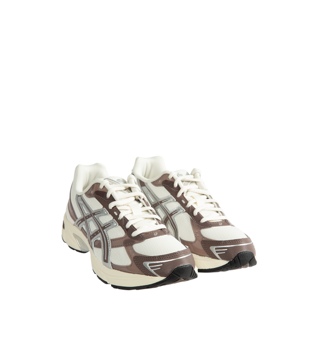 Image 2 of 5 - NEUTRAL - Asics Unisex Gel-1130 Sneakers feature patent leather overlays, clear gloss TPU accents, and breathable mesh underlays for a modern look. Enhanced with cushioning and support designed for all-day comfort, the GEL-1130 delivers the perfect blend of heritage performance and everyday wearability. Main Material: Mesh Upper with Patent Leather and Gloss TPU Overlays. Cushioning: GEL Technology. Details: GEL-1000 Series Heritage Design, Breathable Mesh Construction *Unisex style in men's  