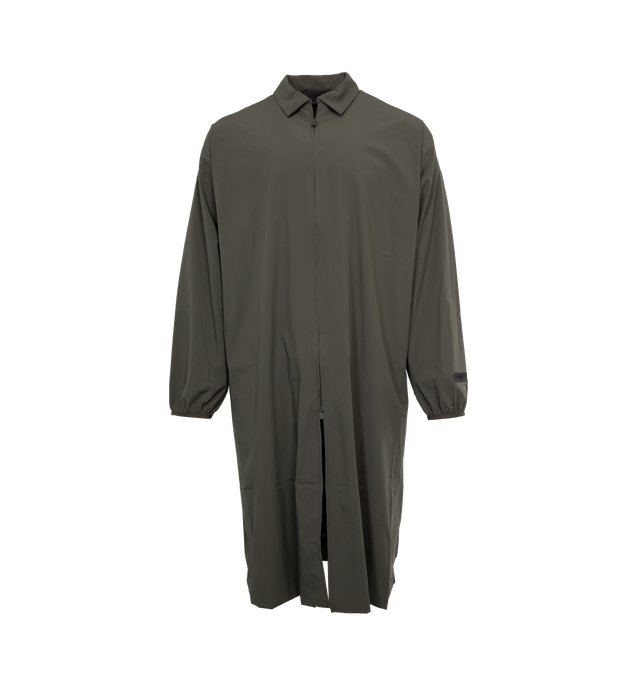BLACK - FEAR OF GOD ESSENTIALS Car Coat featuring spread collar, two-way zip closure, seam pockets, dropped shoulders, rubberized logo patch at sleeve and back, elasticized cuffs and fully lined. 86% nylon, 14% spandex. Lining: 100% polyester. Made in China.