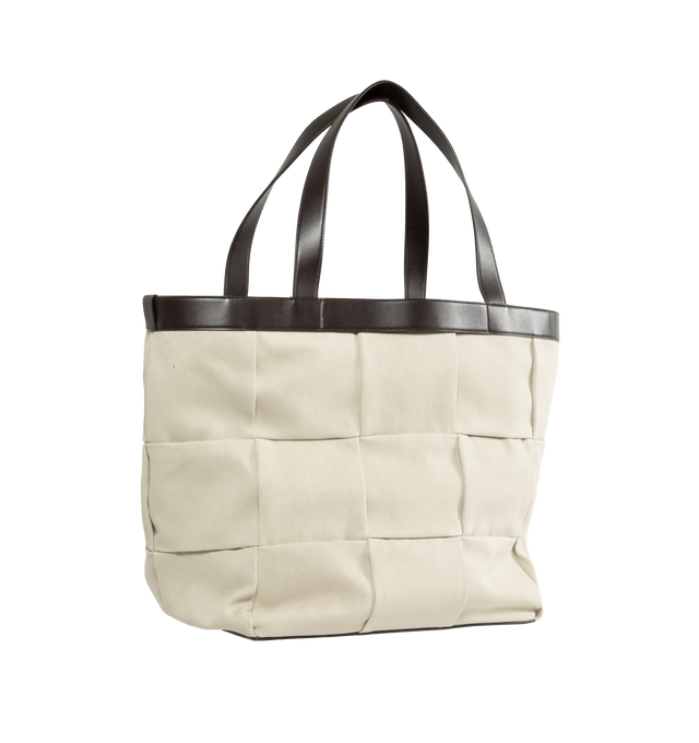 Image 2 of 3 - WHITE - BOTTEGA VENETA Canvas Tote featuring smooth canvas in intrecciato-pattern weave, leather handles, interior has one zip pocket and two open pockets and buckle closure. Canvas and leather. Made in Italy. 