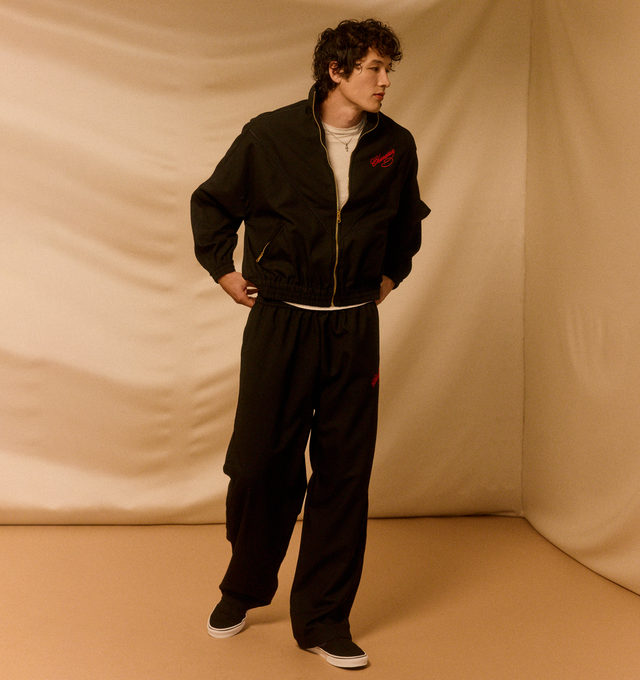 Image 3 of 5 - BLACK - WILLY CHAVARRIA Ruff Ryder Jacket featuring a nylon taffeta piped throughout, full lining, script inspired logo, stand collar, zip closure, zip pockets and elasticated trims. 100% nylon. Made in the USA. 