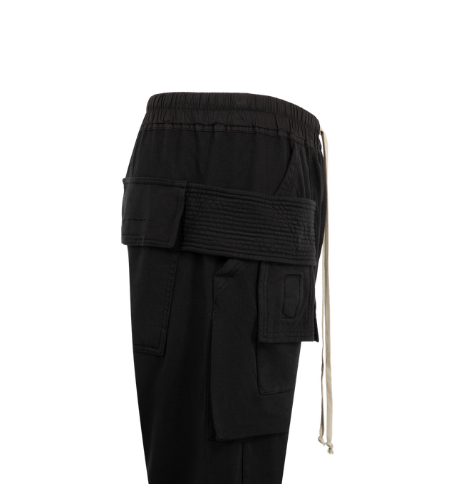 Image 3 of 3 - BLACK - Rick Owens Drkshdw Men's Creatch Cargo Drawstring Pants are crafted from cotton and feature an elasticized waistband with a drawstring closure. Designed with a relaxed cargo-inspired silhouette, these pants include side pockets, back flap pockets, and cargo flap pockets for functional storage. Main Material: 100% Cotton. Waistband: 97% Cotton, 3% Elastane. Pockets: Side Pockets, Back Flap Pockets, Cargo Flap Pockets. Made in Italy. 