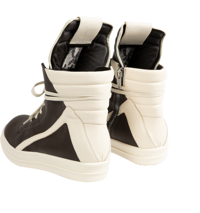 Image 3 of 5 - MULTI - Rick Owens Mens Geobasket High-Top Sneakers feature a full-grain cow leather upper. Designed with an above-ankle silhouette, extended tongue with webbing pull tab, signature geometric paneling, padded back counter, contrast laces, inner ankle zip closure, and shark-tooth thermoplastic rubber outsole. Upper: 100% Cow Leather; Lining: 100% Calf Leather; Insole: 100% Calf Leather; Outsole: 100% Thermoplastic Rubber. Sole Height: 3.5 cm. Made in Italy. 