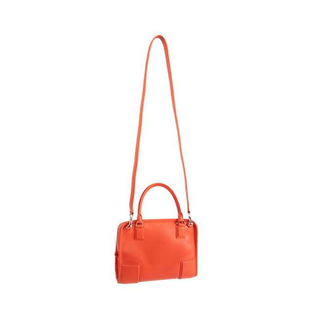 Image 2 of 4 - ORANGE - Loewe Small Amazona 180 Bag in leather features a relaxed silhouette anchored by a single toron top handle, designed to be carried open, while a concealed closure secures the main compartment, three carry options: short handle, removable shoulder strap and crossbody, zip closure with two leather zip pullers, two compartments, main compartment closed with magnetic closure, internal flat pocket, left side d-ring for customization, nappa lambskin lining, and embossed double L branding.  