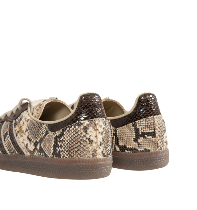 Image 3 of 5 - BROWN - Adidas Mens Snake-Effect Sneakers are crafted from calf leather. Features a snake-effect finish, round toe, lace-up closure, signature 3-Stripes, logo-print tongue, branded heel counter, and flat rubber sole. Upper: Calf Leather; Lining: Calf Leather; Sole: Rubber. Made in Vietnam. 