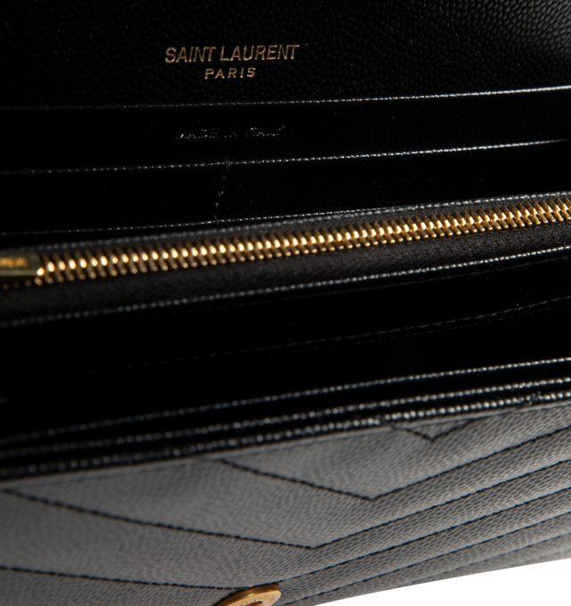 Image 3 of 3 - BLACK - SAINT LAURENT Large Wallet featuring large flap wallet made with metal-free tanned leather, cassandre on front, gold-toned metal hardware, snap button fastening, twelve card slots, one coin pocket, two bill compartments, two receipt compartments and quilted overstitching. 7.4 x 4.3 x 1.1 inches. Calfskin. Made in Italy. 