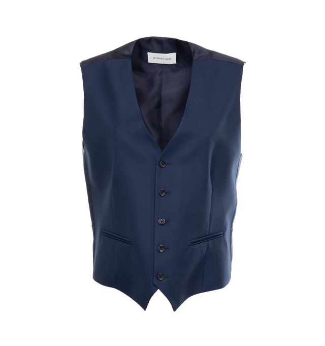 BLUE - ARMARIUM Mark Wool Waistcoat featuring panelled design, v-neck, sleeveless, dart detailing, two side welt pockets, adjustable strap to the rear, full lining, asymmetric hem and front button fastening. 100% wool. Lining: 100% cupro.