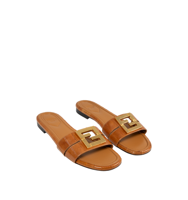 Image 2 of 4 - BROWN - FENDI FFold Slide Eel Leather Sandals featuring slip-on flats with square toes and two wrap-around bands, metal FF detail, with a special design that includes a functional hinge in the center. Made of shiny beige eel leather. Gold-finish metalware. Made in Italy. 