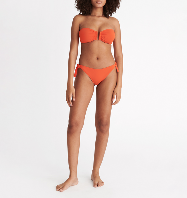Image 3 of 6 - ORANGE - ERES Show Bandeau Bikini Top featuring bust shirring at front and sides, U-shaped metal link between cups, side stays and branded large back clasp. 84% Polyamid, 16% Spandex. Made in Italy. 
