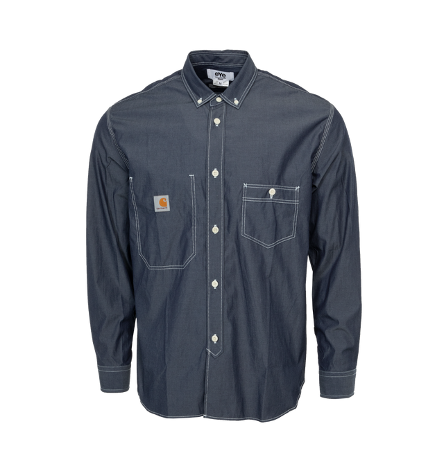 Image 1 of 3 - BLUE - JUNYA WATANABE x CARHARTT Chambray Shirt featuring patch pockets on the chest, button down fastenings, button down collar and contrasting stitching. 100% cotton. 