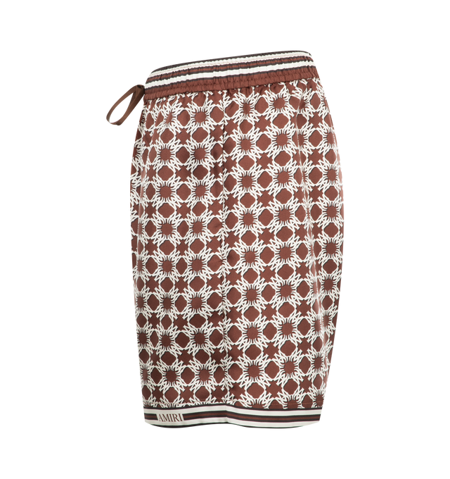 Image 3 of 3 - BROWN - Amiri MA Elastic Waist Quad Shorts have an elastic drawstring waist and a graphic print. 100% silk twill. Made in Italy.  