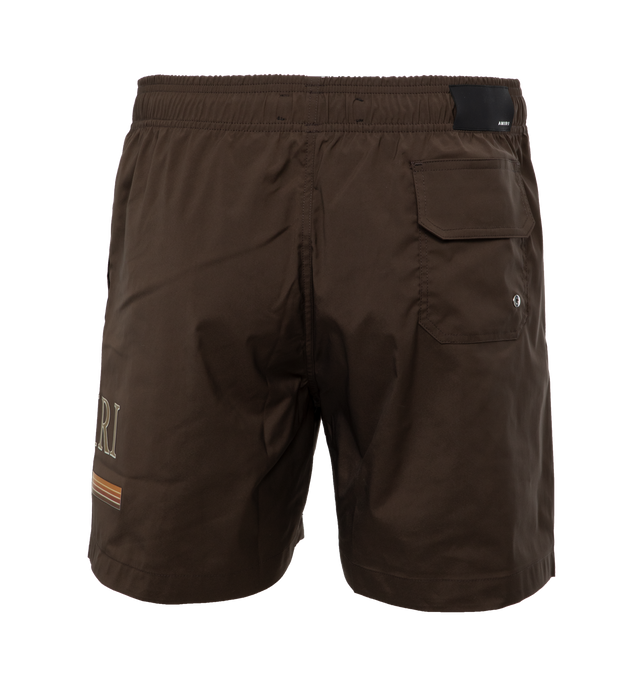 Image 2 of 4 - BROWN - AMIRI Swimshort featuring a gradient bar logo at the left thigh, crafted with side seam pockets, back flap pocket, elastic waist and drawcord. Made in Italy.  90% POLYESTER 10% SPANDEX. 