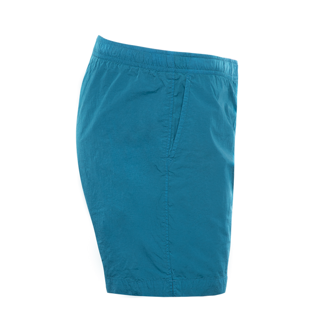 Image 3 of 3 - BLUE - C.P. COMPANY Eco-Chrome R Swim Shorts featuring tonal stitching, two side slash pockets, logo patch to the leg, short side slits, thigh-length, mesh lining and elasticated waistband with internal drawstring. 100% polyamide. 
