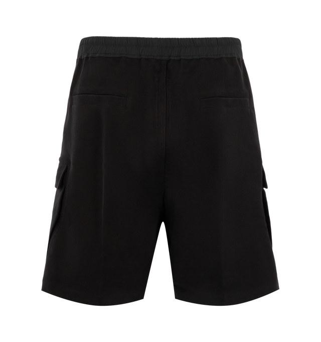 Image 2 of 3 - BLACK - Rick Owens Mens Cargobela Shorts are crafted from overdyed waxed cotton denim. Feature a knee-length wide-leg silhouette, dropped crotch, elasticized waistband with drawstring, exposed Bela front zip closure with dual snap buttons, concealed snap cargo pockets, rear welt pockets, and topstitch detailing. Main Material: 100% Cotton; Waistband: 97% Cotton, 3% Elastane. Made in Italy. 