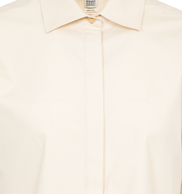 Image 3 of 3 - WHITE - TOTEME Cropped Cotton Poplin Shirt featuring a wide, cropped silhouette, light organic-cotton poplin with a concealed button placket and a neat box pleat running down the back. 100% organic cotton. 