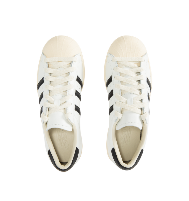 Image 5 of 5 - WHITE - ADIDAS Superstar Vintage Sneaker featuring shell toe, 3-Stripes and heel tab, a leather upper, lining and insole all sits atop a classic rubber cupsole, regular fit, lace closure and rubber outsole. 