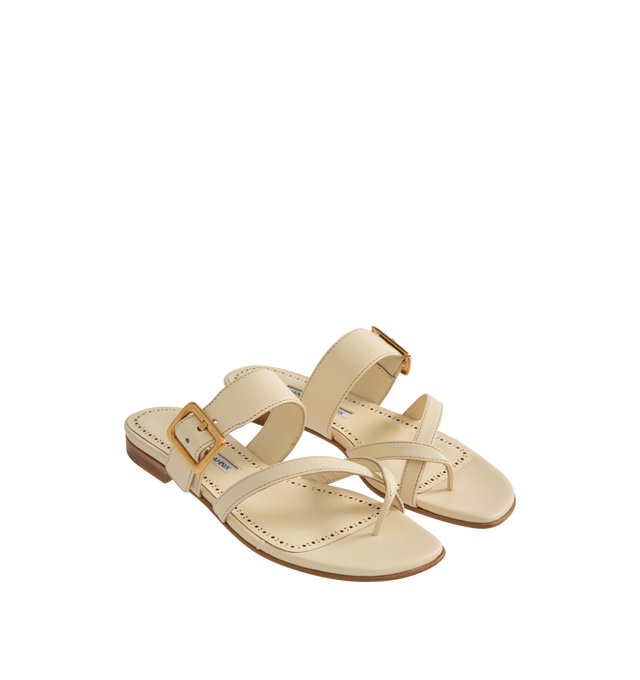 Image 2 of 4 - NEUTRAL - Manolo Blahnik Thalusa nappa leather flat sandals featuring an open toe, crossover front straps with toe stem, instep strap with gold buckle design detail and flat stacked 10mm heel. Upper: 100% lamb nappa. Sole: 100% calf leather. Lining: 100% kid leather. Made in Italy. 