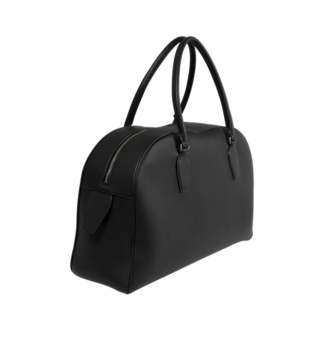 Image 2 of 3 - BLACK - The Row India 15.75 Updated bowling bag in textured calfskin leather with tubular handles, branded metal padlock and key, and zipper closure. Measures 15.35 x 10.24 x 5.51 inches with 6.30 inch handle drop. 100% Calfskin Leather. Lined in 100% Leather. Made in Italy. 