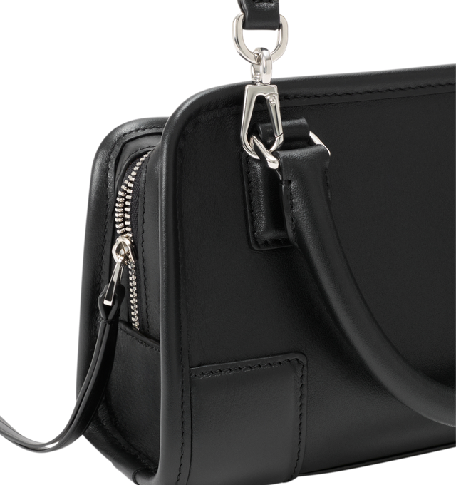 Image 11 of 11 - BLACK - Loewe Mini Amazona 180 Bag in leather features a relaxed silhouette anchored by a single toron top handle, designed to be carried open, while a concealed closure secures the main compartment, removable shoulder and crossbody straps, two carry options: short handle, removable and adjustable crossbody strap, zip closure with two leather zip pullers, two compartments, main compartment closed with magnetic closure, left side d-ring for customization, suede and nappa lambskin lining, and 